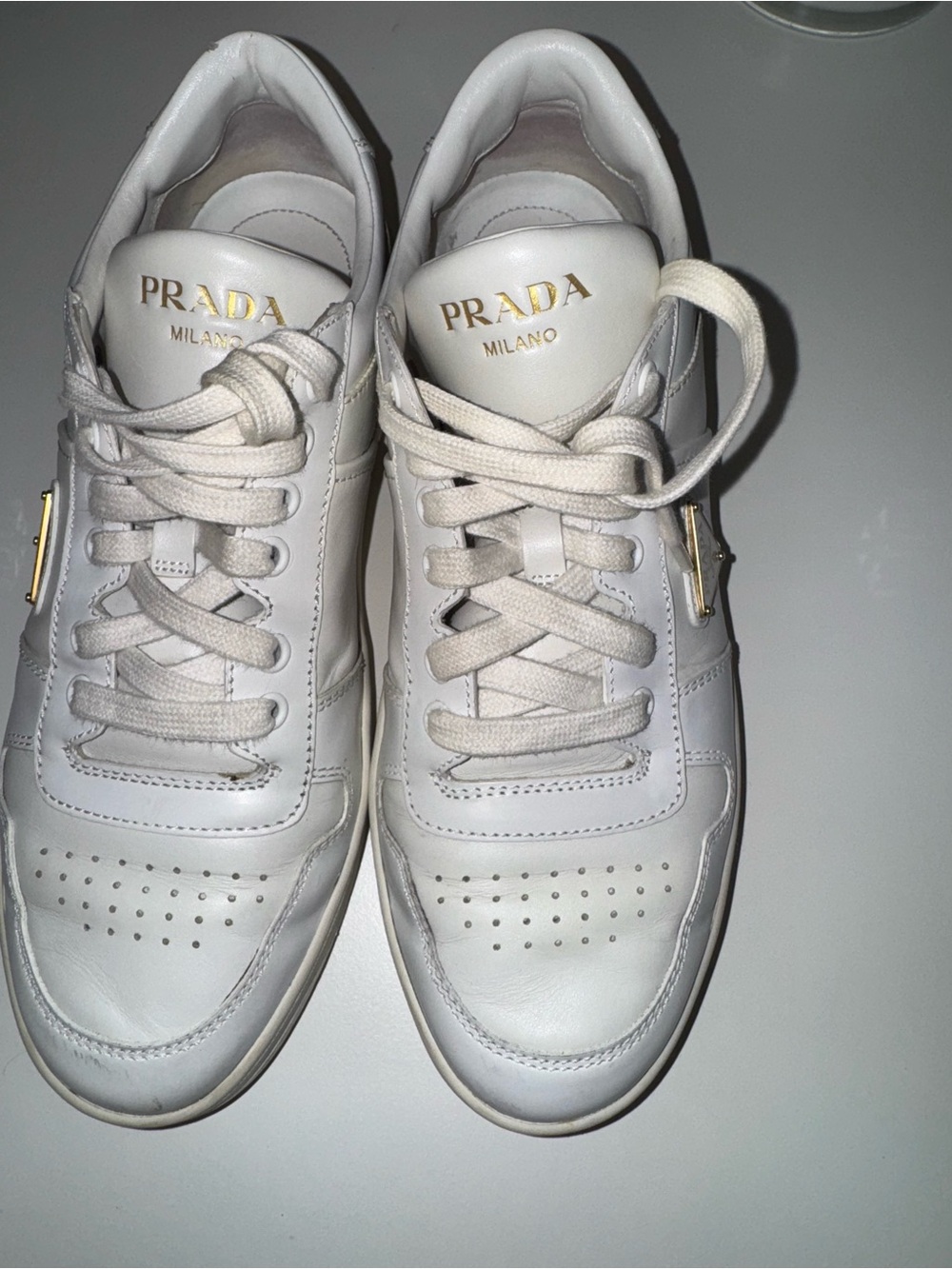 Prada White Leather Low-Top Sneakers with Gold Logo